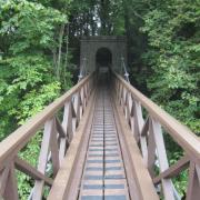The suspension bridge at Sizergh Castle that crosses the River Kent