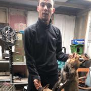 Dane Crawford pictured holding a dead fox