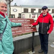 Mayor and her husband, Jim, looking at the twin town sign
