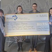 The Holiday Inn team presenting the cheque last week