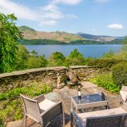 The cannon on a terrace at The Fort, which enjoys spectacular views across Derwentwater to the fells beyond