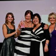 Jane and Denise picking up their prize at the EVA awards