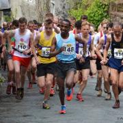 Wegene Tafese leads the pack in the senior men's Inter-Counties fell race. Photo by Dave Woodhead of woodentops.org.uk