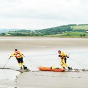 Rescuers begin the delicate job of making their way out to the couple trapped at Sandside