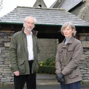 SKELSMERGH WW1 HERITAGE LOTTERY GRANT.  Pictured are Tony Cousins, Parish Historian, and Helen Atkinson, Church Warden beside the lychgate of the Church of St. John the Baptist, Skelsmergh - the church council has been awarded £5900 from the Heritag