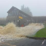 Water flooding from the entrance to White Scar Cave (Picture by Thomas Beresford)