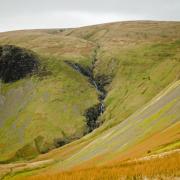 Cautley Spout is a series of four waterfalls where Red Gill Beck tumbles over the edge of Cautley Crags into a wide glacial corrie