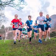 Rosie Woodhams, left, taking on male and female rivals during the recent Cumbrian cross country championships