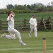 Shireshead's Dave Jack on his way to a seven wicket haul