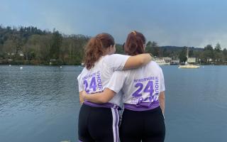 Molly Conway and Daniella Flemons taking in their achievement by Windermere Lake