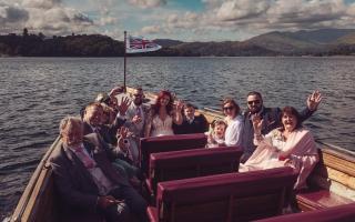 Newlyweds with their 10 guests on the wooden jetty