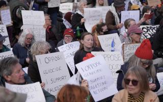 Protesters hold up placards at a demonstration against the ban on Palestine Action, in Trafalgar Square, central London