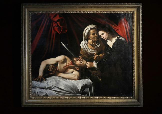 The 'Lost Caravaggio' which was discovered in the attic of a Toulouse farmhouse in 2014 is seen at a press conference in central London. (Jonathan Brady/PA Wire)